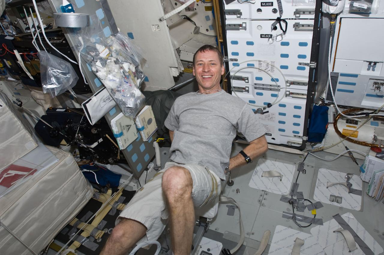 S125-E-009943 (18 May 2009) --- Astronaut Gregory C. Johnson, STS-125 pilot, exercises on the bicycle ergometer on the middeck of the Earth-orbiting Space Shuttle Atlantis.