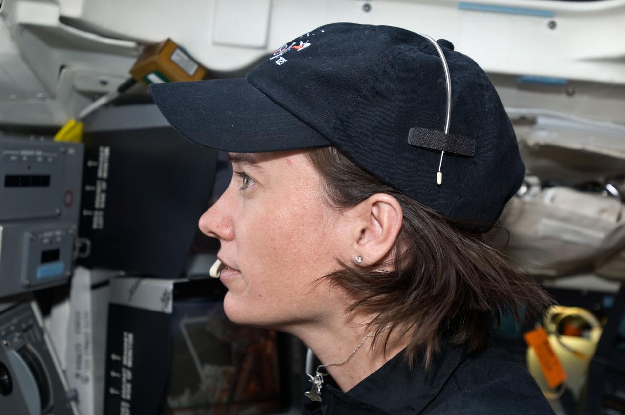 S125-E-009956 (18 May 2009) --- Astronaut Megan McArthur, STS-125 mission specialist, is pictured on the aft flight deck of the Earth-orbiting Space Shuttle Atlantis during flight day eight activities.