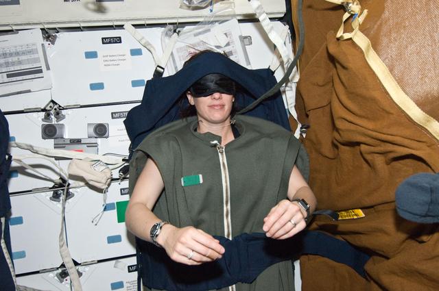 NASA image: MS2 Megan McArthur sleeps on the Middeck