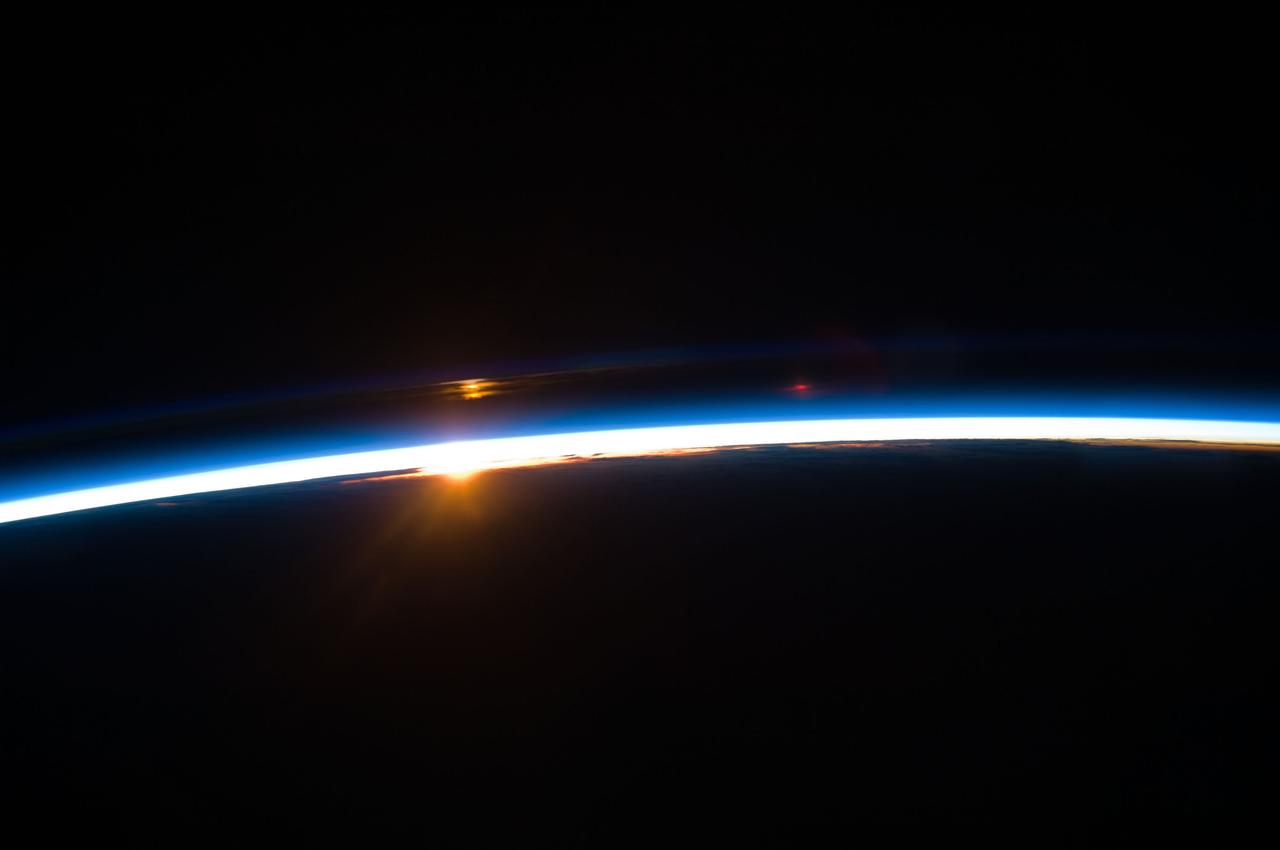 S125-E-012189 (19 May 2009) --- The thin line of Earth?s atmosphere and the rising sun are featured in this image photographed by an STS-125 crewmember on the Earth-orbiting Space Shuttle Atlantis on flight day nine.