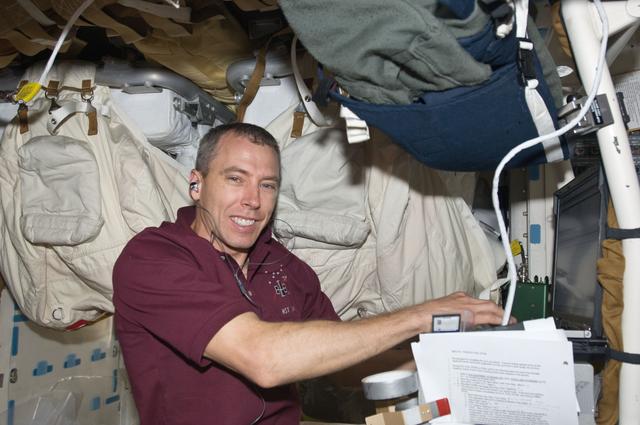 NASA image: View of MS5 Andrew Feustel working on a Laptop in the Middeck