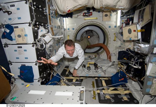 NASA image: View of Pilot Gregory Johnson posing for a photo in the Middeck