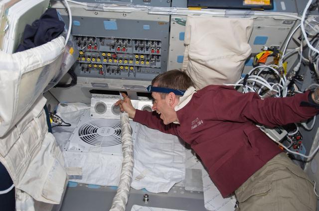 NASA image: View of Pilot Gregory C. Johnson during IFM on the Flight Deck