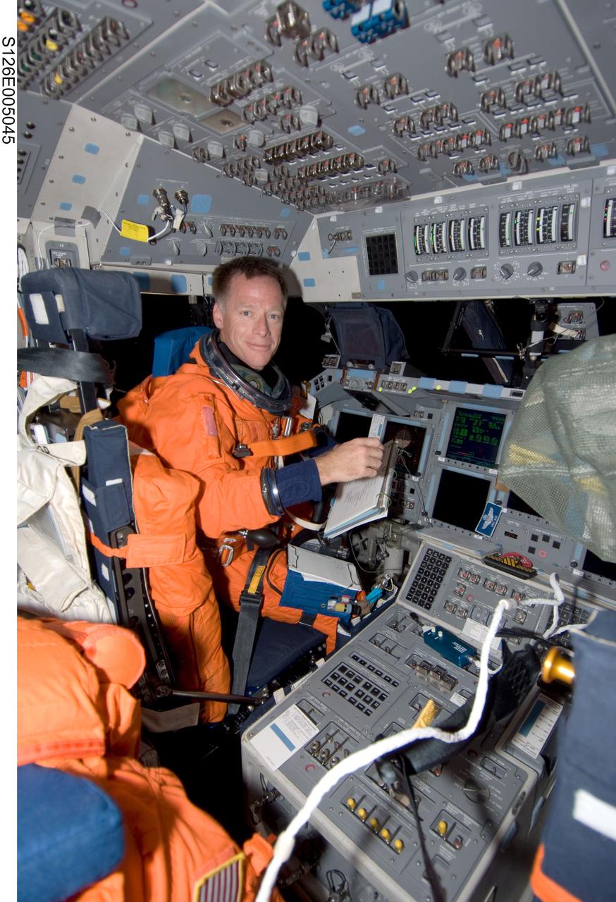 S126-E-005045 (14 Nov. 2008) --- Astronaut Chris Ferguson, STS-126 commander, attired in his shuttle launch and entry suit, takes a moment for a photo while occupying the commander's station on the flight deck of Space Shuttle Endeavour during post launch activities.