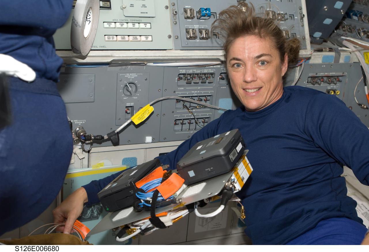 S126-E-006680 (14 Nov. 2008) --- Astronaut Heidemarie Stefanyshyn-Piper, STS-126 mission specialist, takes a moment for a photo on the flight deck of Space Shuttle Endeavour during post launch activities.