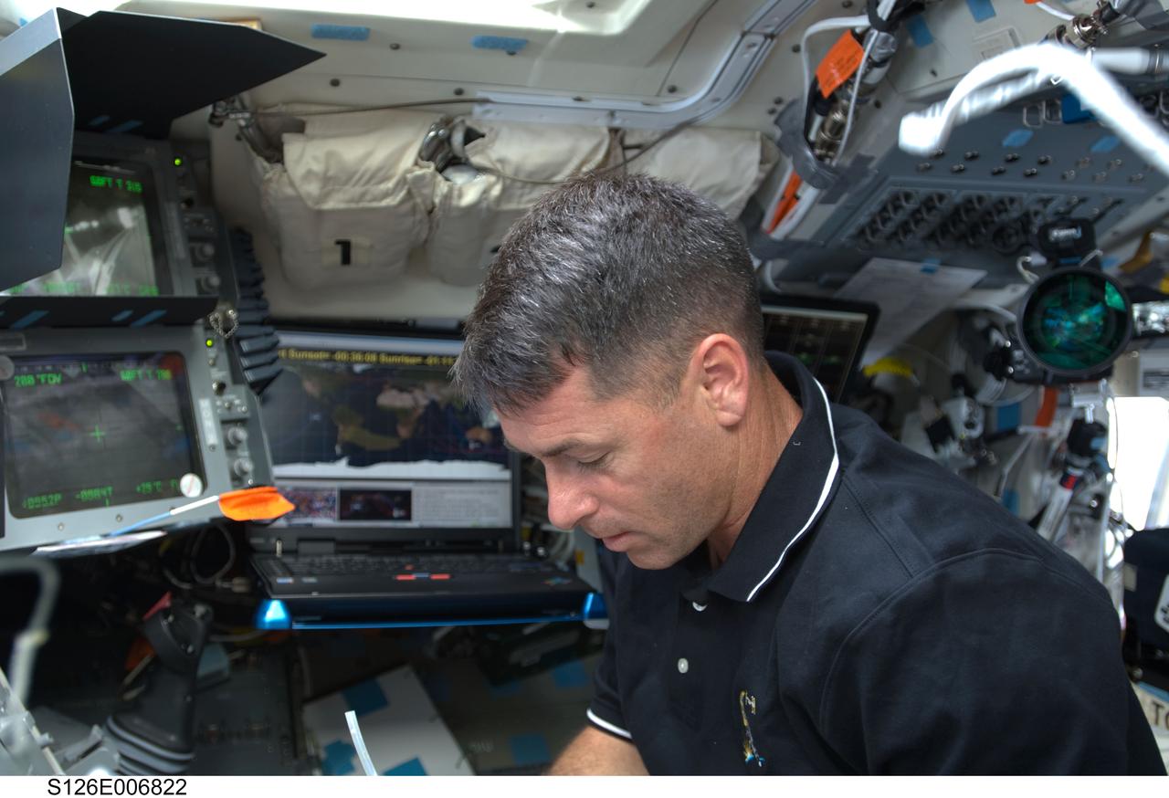 S126-E-006822 (15 Nov. 2008) --- Astronaut Shane Kimbrough, STS-126 mission specialist, works on the flight deck of Space Shuttle Endeavour during flight day two activities.