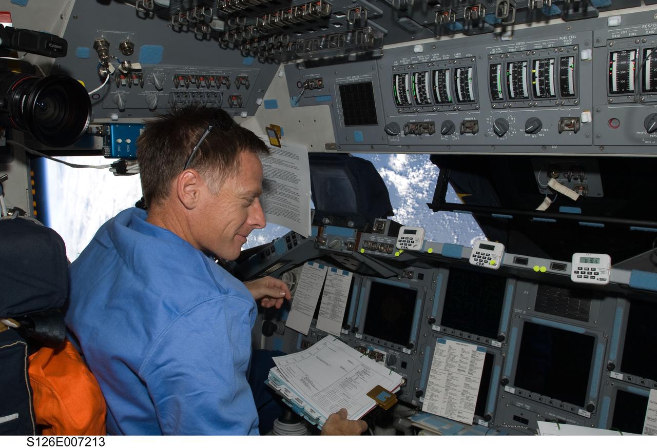 S126-E-007213 (16 Nov. 2008) --- Astronaut Chris Ferguson, STS-126 commander, occupies the commander's station on the forward flight deck of Space Shuttle Endeavour during rendezvous and docking operations with the International Space Station.