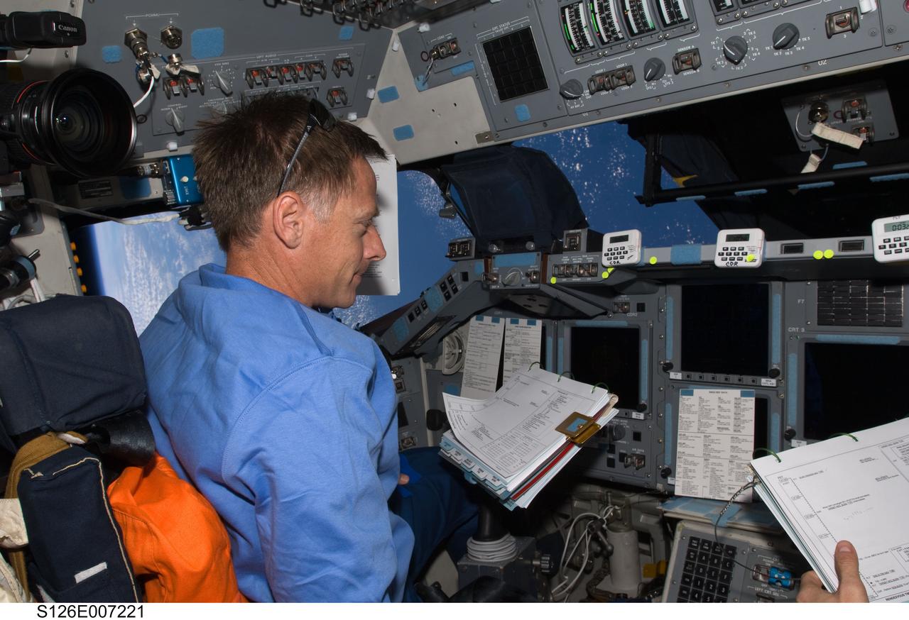 S126-E-007221 (16 Nov. 2008) --- Astronaut Chris Ferguson, STS-126 commander, occupies the commander's station on the forward flight deck of Space Shuttle Endeavour during rendezvous and docking operations with the International Space Station.