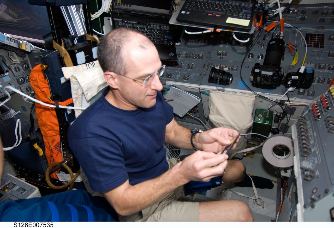 S126-E-007535 (15 Nov. 2008) --- Astronaut Donald Pettit, STS-126 mission specialist, is pictured on the aft flight deck of Space Shuttle Endeavour during flight day two activities.
