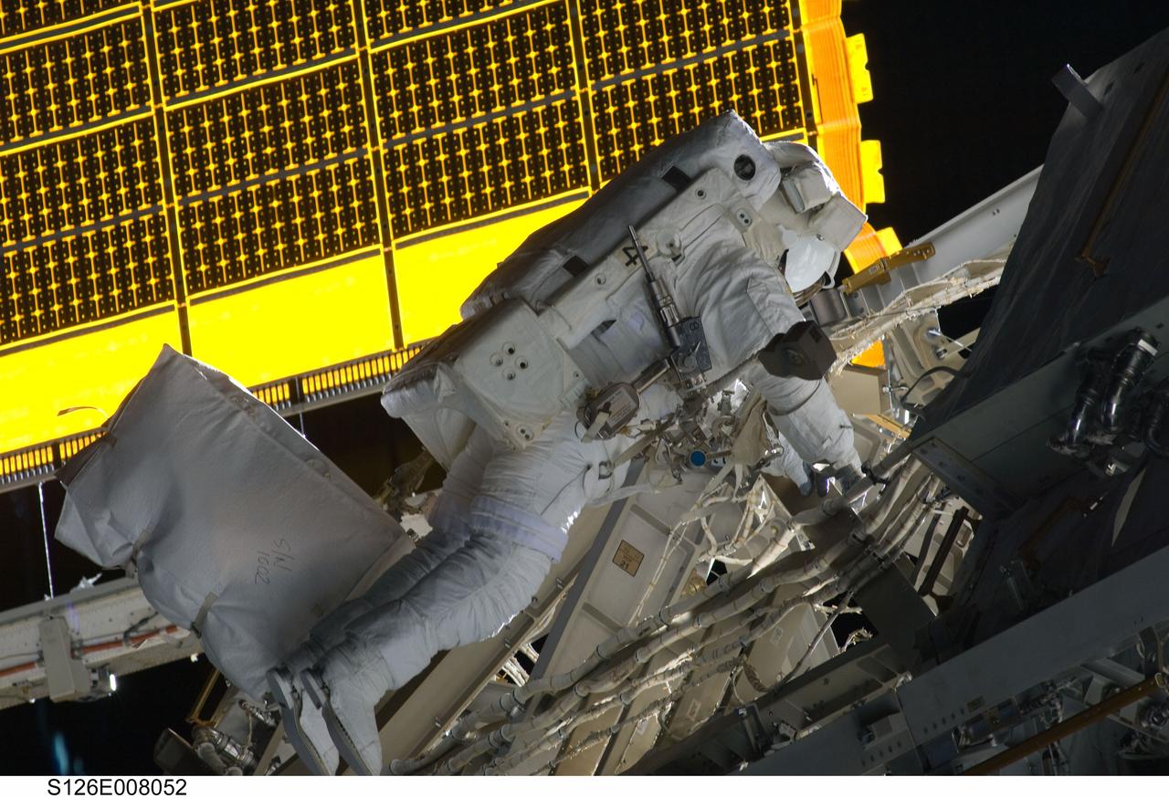 S126-E-008052 (18 Nov. 2008) --- Astronaut Steve Bowen, STS-126 mission specialist, participates in the mission's first session of extravehicular activity (EVA) as construction and maintenance continue on the International Space Station. During the six-hour, 52-minute spacewalk, Bowen and astronaut Heidemarie Stefanyshyn-Piper (out of frame), mission specialist, worked to clean and lubricate part of the station's starboard Solar Alpha Rotary Joints (SARJ) and to remove two of SARJ's 12 trundle bearing assemblies. The spacewalkers also removed a depleted nitrogen tank from a stowage platform on the outside of the complex and moved it into Endeavour's cargo bay. They also moved a flex hose rotary coupler from the shuttle to the station stowage platform, as well as removing some insulation blankets from the common berthing mechanism on the Kibo laboratory.