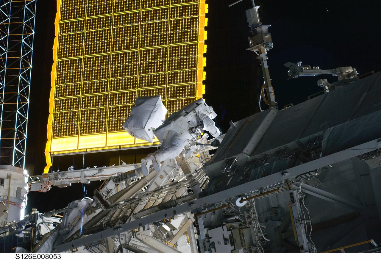 S126-E-008053 (18 Nov. 2008) --- Astronaut Steve Bowen, STS-126 mission specialist, participates in the mission's first session of extravehicular activity (EVA) as construction and maintenance continue on the International Space Station. During the six-hour, 52-minute spacewalk, Bowen and astronaut Heidemarie Stefanyshyn-Piper (out of frame), mission specialist, worked to clean and lubricate part of the station's starboard Solar Alpha Rotary Joints (SARJ) and to remove two of SARJ's 12 trundle bearing assemblies. The spacewalkers also removed a depleted nitrogen tank from a stowage platform on the outside of the complex and moved it into Endeavour's cargo bay. They also moved a flex hose rotary coupler from the shuttle to the station stowage platform, as well as removing some insulation blankets from the common berthing mechanism on the Kibo laboratory.