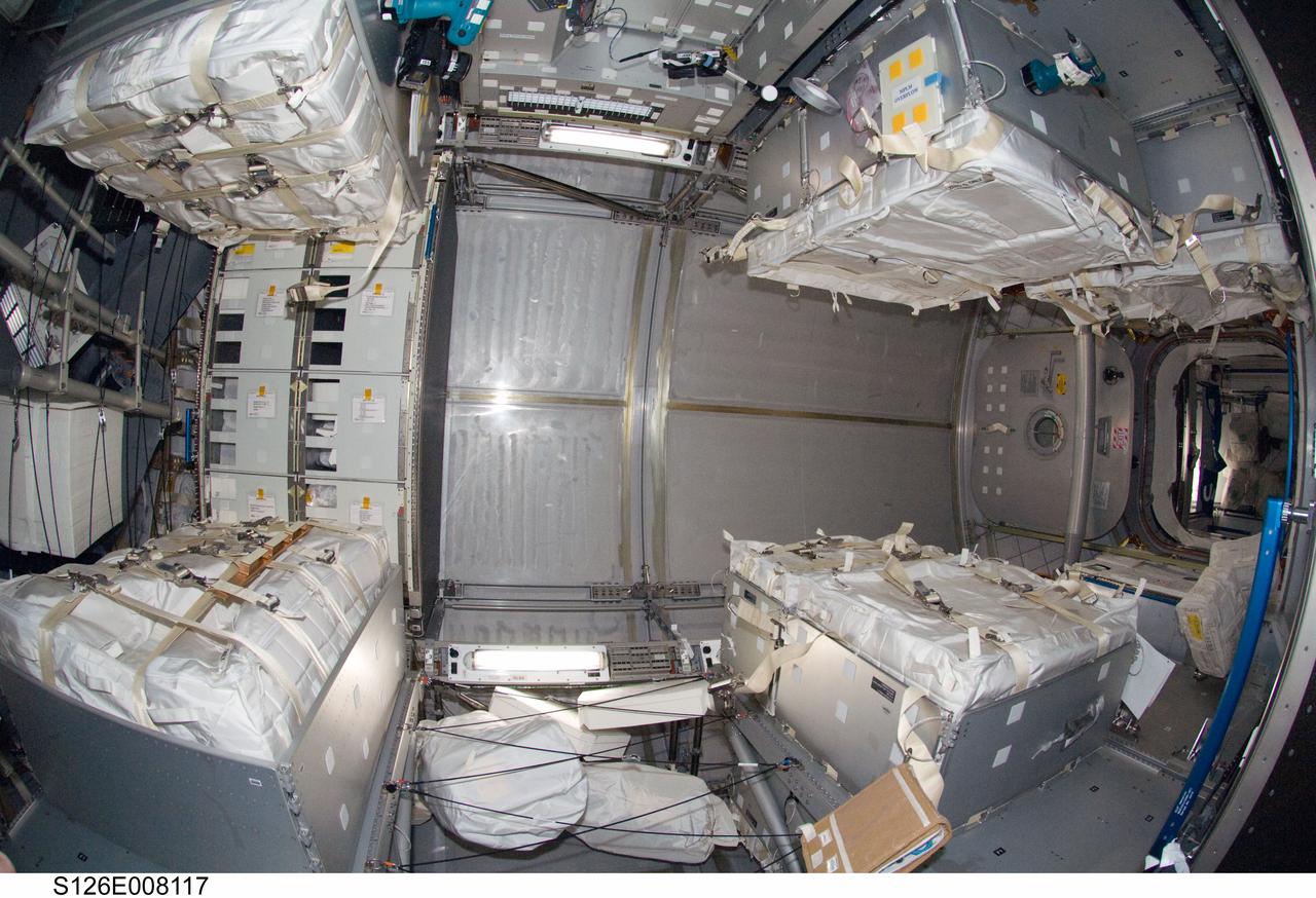 S126-E-008117 (18 Nov. 2008) --- Interior view of the Leonardo Multi-Purpose Logistics Module attached to the Earth-facing port of the International Space Station's Harmony node. Leonardo was moved from Space Shuttle Endeavour's cargo bay and linked to the station on Nov. 17, carrying two water recovery systems racks for recycling urine into potable water, a second toilet system, new gallery components, two new food warmers, a food refrigerator, an experiment freezer, combustion science experiment rack, two separate sleeping quarters and a resistance exercise device (aRED) that allows station crewmembers to perform a variety of exercises.