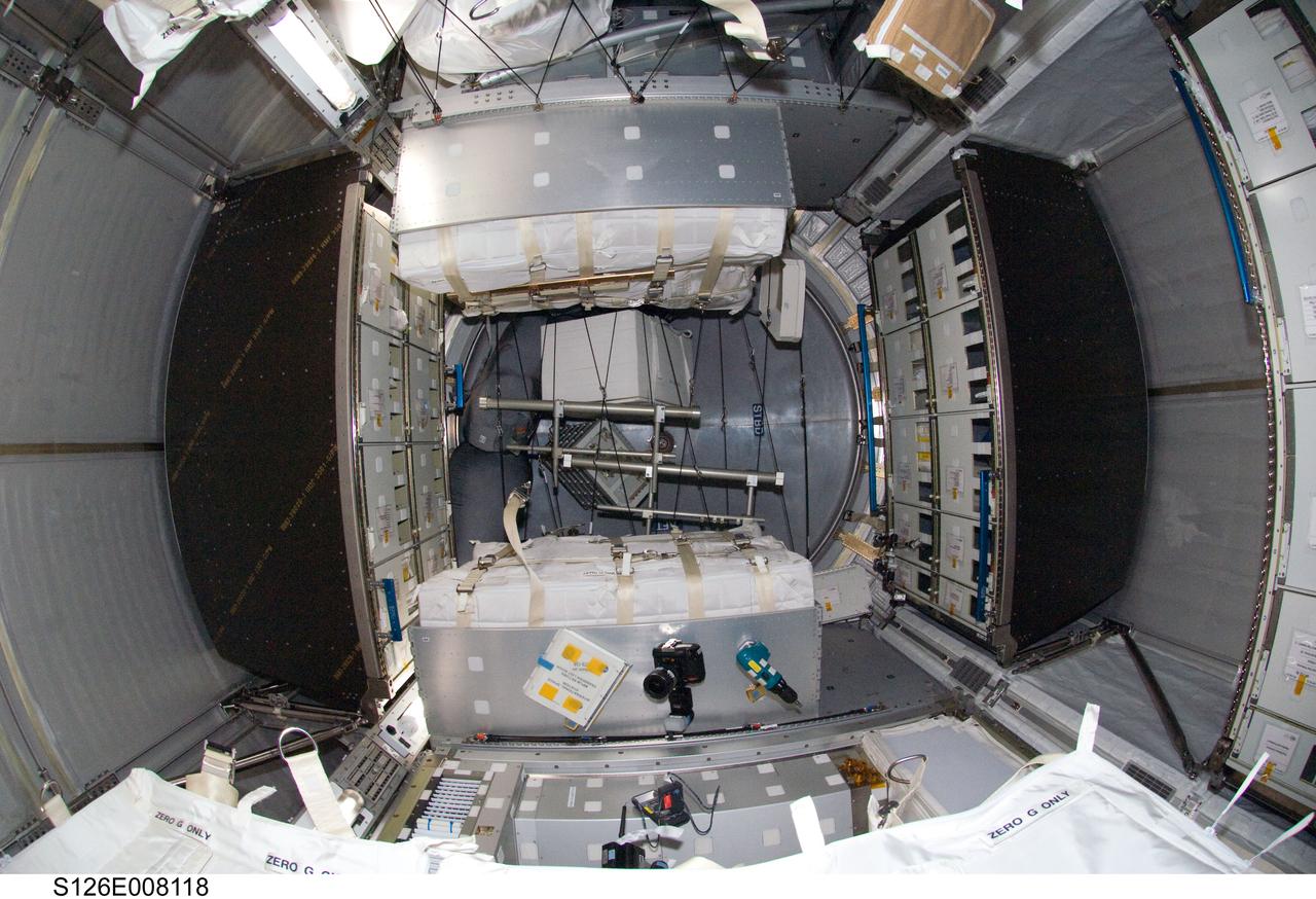 S126-E-008118 (18 Nov. 2008) --- Interior view of the Leonardo Multi-Purpose Logistics Module attached to the Earth-facing port of the International Space Station's Harmony node. Leonardo was moved from Space Shuttle Endeavour's cargo bay and linked to the station on Nov. 17, carrying two water recovery systems racks for recycling urine into potable water, a second toilet system, new gallery components, two new food warmers, a food refrigerator, an experiment freezer, combustion science experiment rack, two separate sleeping quarters and a resistance exercise device (aRED) that allows station crewmembers to perform a variety of exercises.