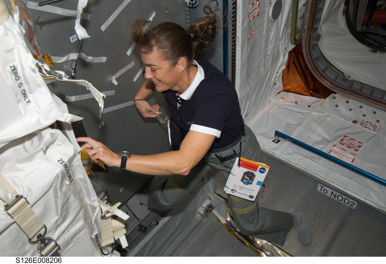 S126-E-008206 (19 Nov. 2008) --- Astronaut Heidemarie Stefanyshyn-Piper, STS-126 mission specialist, works in the Leonardo Multi-Purpose Logistics Module attached to the Earth-facing port of the International Space Station's Harmony node while Space Shuttle Endeavour is docked with the station.