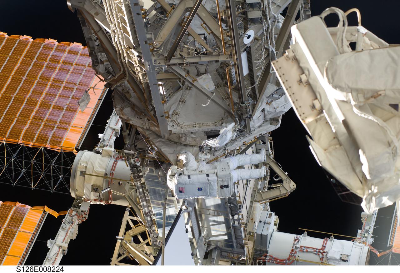 S126-E-008224 (18 Nov. 2008) --- Astronaut Steve Bowen, STS-126 mission specialist, participates in the mission's first session of extravehicular activity (EVA) as construction and maintenance continue on the International Space Station. During the six-hour, 52-minute spacewalk, Bowen and astronaut Heidemarie Stefanyshyn-Piper (out of frame), mission specialist, worked to clean and lubricate part of the station's starboard Solar Alpha Rotary Joints (SARJ) and to remove two of SARJ's 12 trundle bearing assemblies. The spacewalkers also removed a depleted nitrogen tank from a stowage platform on the outside of the complex and moved it into Endeavour's cargo bay. They also moved a flex hose rotary coupler from the shuttle to the station stowage platform, as well as removing some insulation blankets from the common berthing mechanism on the Kibo laboratory.
