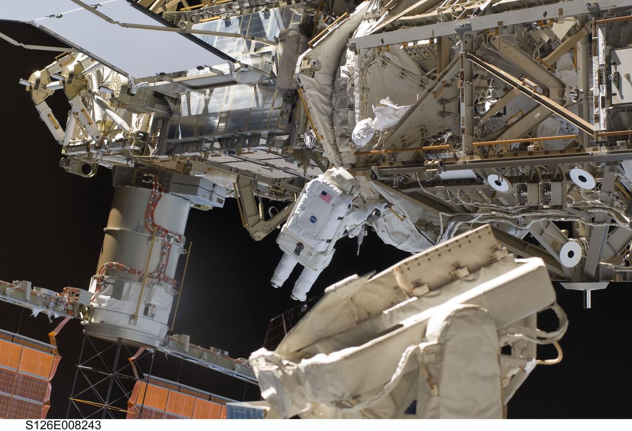 S126-E-008243 (18 Nov. 2008) --- Astronaut Steve Bowen, STS-126 mission specialist, participates in the mission's first session of extravehicular activity (EVA) as construction and maintenance continue on the International Space Station. During the six-hour, 52-minute spacewalk, Bowen and astronaut Heidemarie Stefanyshyn-Piper (out of frame), mission specialist, worked to clean and lubricate part of the station's starboard Solar Alpha Rotary Joints (SARJ) and to remove two of SARJ's 12 trundle bearing assemblies. The spacewalkers also removed a depleted nitrogen tank from a stowage platform on the outside of the complex and moved it into Endeavour's cargo bay. They also moved a flex hose rotary coupler from the shuttle to the station stowage platform, as well as removing some insulation blankets from the common berthing mechanism on the Kibo laboratory.