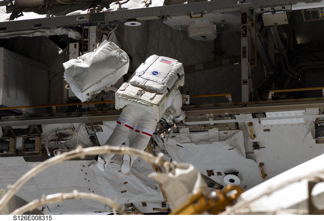 S126-E-008315 (20 Nov. 2008) --- Astronaut Heidemarie Stefanyshyn-Piper, STS-126 mission specialist, participates in the mission's second scheduled session of extravehicular activity (EVA) as construction and maintenance continue on the International Space Station. During the six-hour, 45-minute spacewalk, Piper and astronaut Shane Kimbrough (out of frame), mission specialist, continued the process of removing debris and applying lubrication around the starboard Solar Alpha Rotary Joint (SARJ), replaced four more of the SARJ's 12 trundle bearing assemblies, relocated two equipment carts and applied lubrication to the station's robotic Canadarm2.