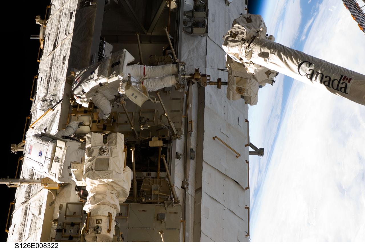 S126-E-008322 (20 Nov. 2008) --- Astronauts Heidemarie Stefanyshyn-Piper and Shane Kimbrough (anchored to a Canadarm2 mobile foot restraint), both STS-126 mission specialists, participate in the mission's second scheduled session of extravehicular activity (EVA) as construction and maintenance continue on the International Space Station. During the six-hour, 45-minute spacewalk, Piper and Kimbrough continued the process of removing debris and applying lubrication around the starboard Solar Alpha Rotary Joint (SARJ), replaced four more of the SARJ's 12 trundle bearing assemblies, relocated two equipment carts and applied lubrication to the station's robotic Canadarm2.