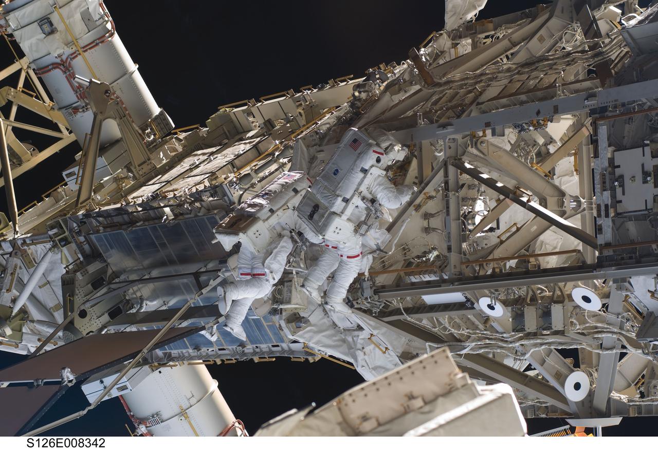 S126-E-008342 (20 Nov. 2008) --- Astronauts Heidemarie Stefanyshyn-Piper (left) and Shane Kimbrough, both STS-126 mission specialists, participate in the mission's second scheduled session of extravehicular activity (EVA) as construction and maintenance continue on the International Space Station. During the six-hour, 45-minute spacewalk, Piper and Kimbrough continued the process of removing debris and applying lubrication around the starboard Solar Alpha Rotary Joint (SARJ), replaced four more of the SARJ's 12 trundle bearing assemblies, relocated two equipment carts and applied lubrication to the station's robotic Canadarm2.