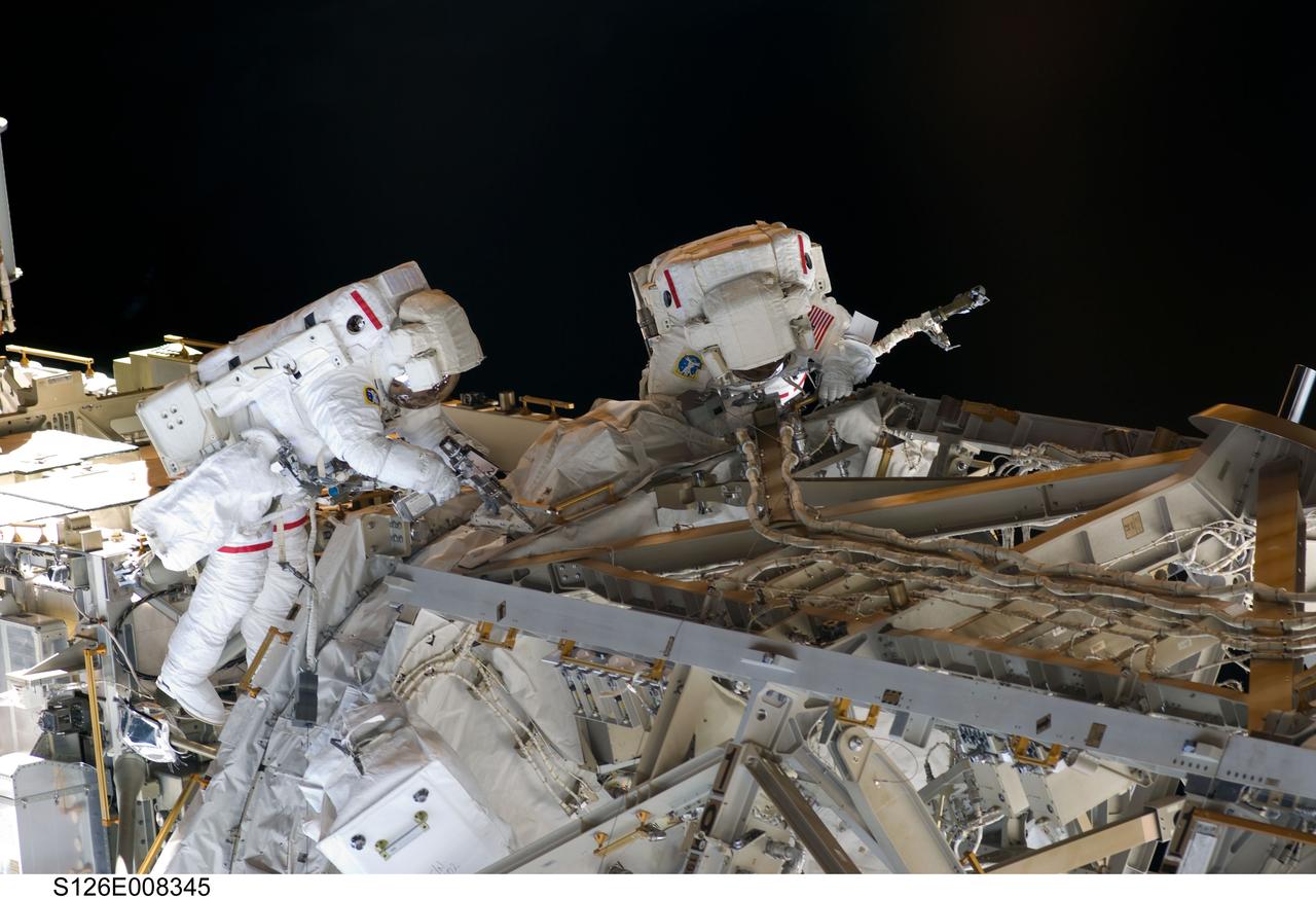 S126-E-008345 (20 Nov. 2008) --- Astronauts Heidemarie Stefanyshyn-Piper (left) and Shane Kimbrough, both STS-126 mission specialists, participate in the mission's second scheduled session of extravehicular activity (EVA) as construction and maintenance continue on the International Space Station. During the six-hour, 45-minute spacewalk, Piper and Kimbrough continued the process of removing debris and applying lubrication around the starboard Solar Alpha Rotary Joint (SARJ), replaced four more of the SARJ's 12 trundle bearing assemblies, relocated two equipment carts and applied lubrication to the station's robotic Canadarm2.
