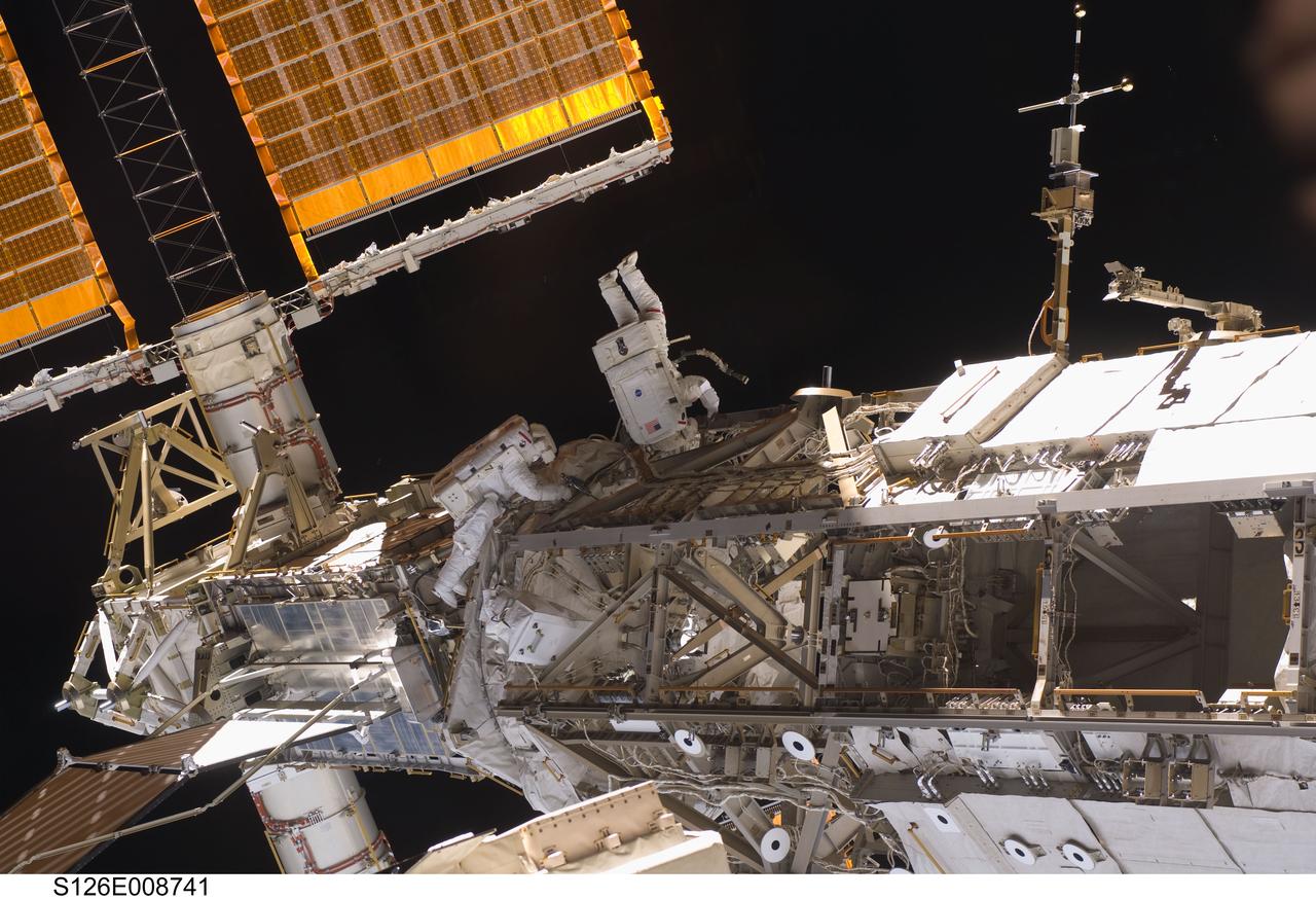 S126-E-008741 (20 Nov. 2008) --- Astronauts Heidemarie Stefanyshyn-Piper (left) and Shane Kimbrough, both STS-126 mission specialists, participate in the mission's second scheduled session of extravehicular activity (EVA) as construction and maintenance continue on the International Space Station. During the six-hour, 45-minute spacewalk, Piper and Kimbrough continued the process of removing debris and applying lubrication around the starboard Solar Alpha Rotary Joint (SARJ), replaced four more of the SARJ's 12 trundle bearing assemblies, relocated two equipment carts and applied lubrication to the station's robotic Canadarm2.