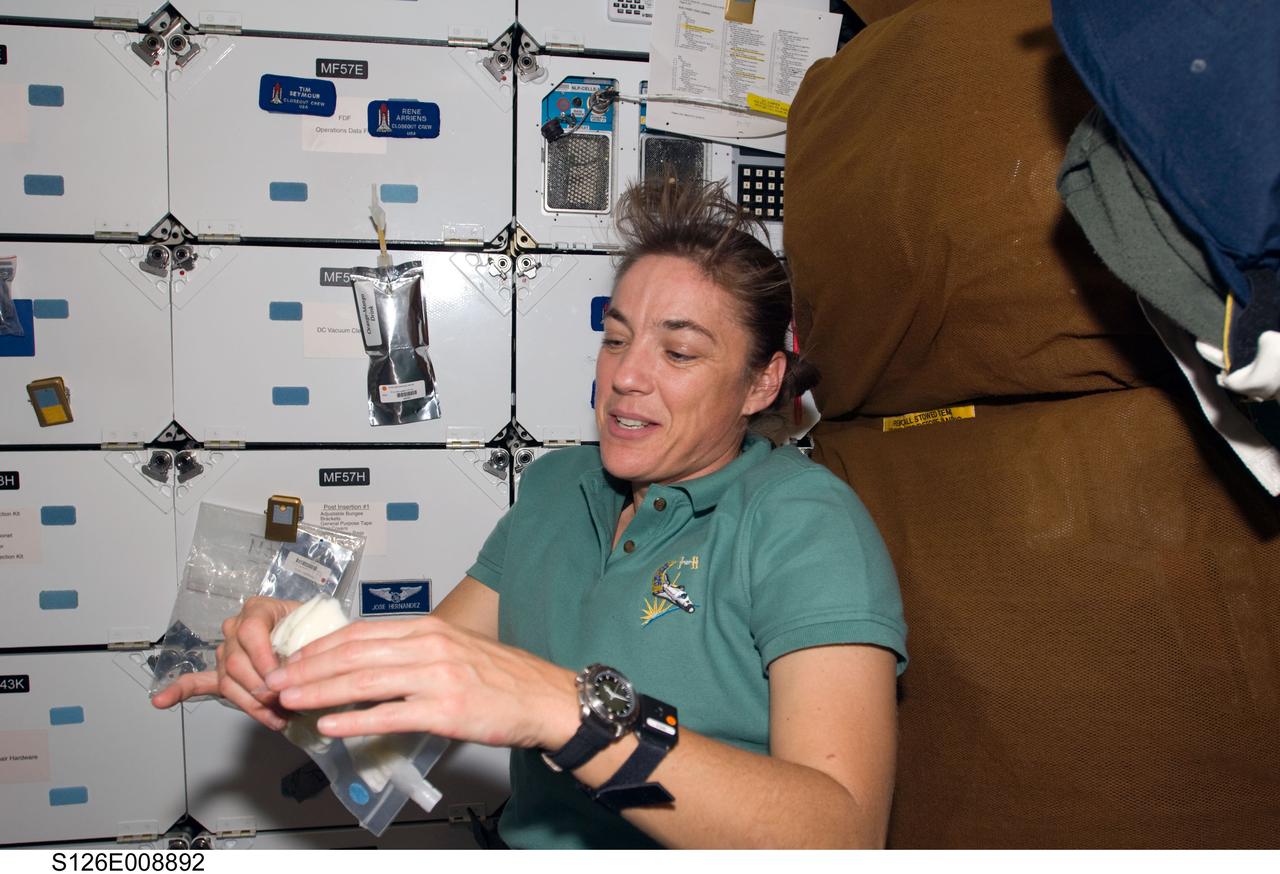 S126-E-008892 (21 Nov. 2008) --- This image, recorded in the late evening hours of Nov. 21, Houston time, shows astronaut Heidemarie Stefanyshyn-Piper on the mid deck of the Space Shuttle Endeavour. Just a few hours after this photo was taken, Stefanyshyn-Piper was one of two astronauts who started prepping for the joint crews' third spacewalk (and Stefanyshyn-Piper's third) of the week. Members of the shuttle and station crews, commanded by astronauts Chris Ferguson and Michael Fincke, respectively, are spending close to two weeks in space together, accomplishing home improvement chores and a number of other tasks.