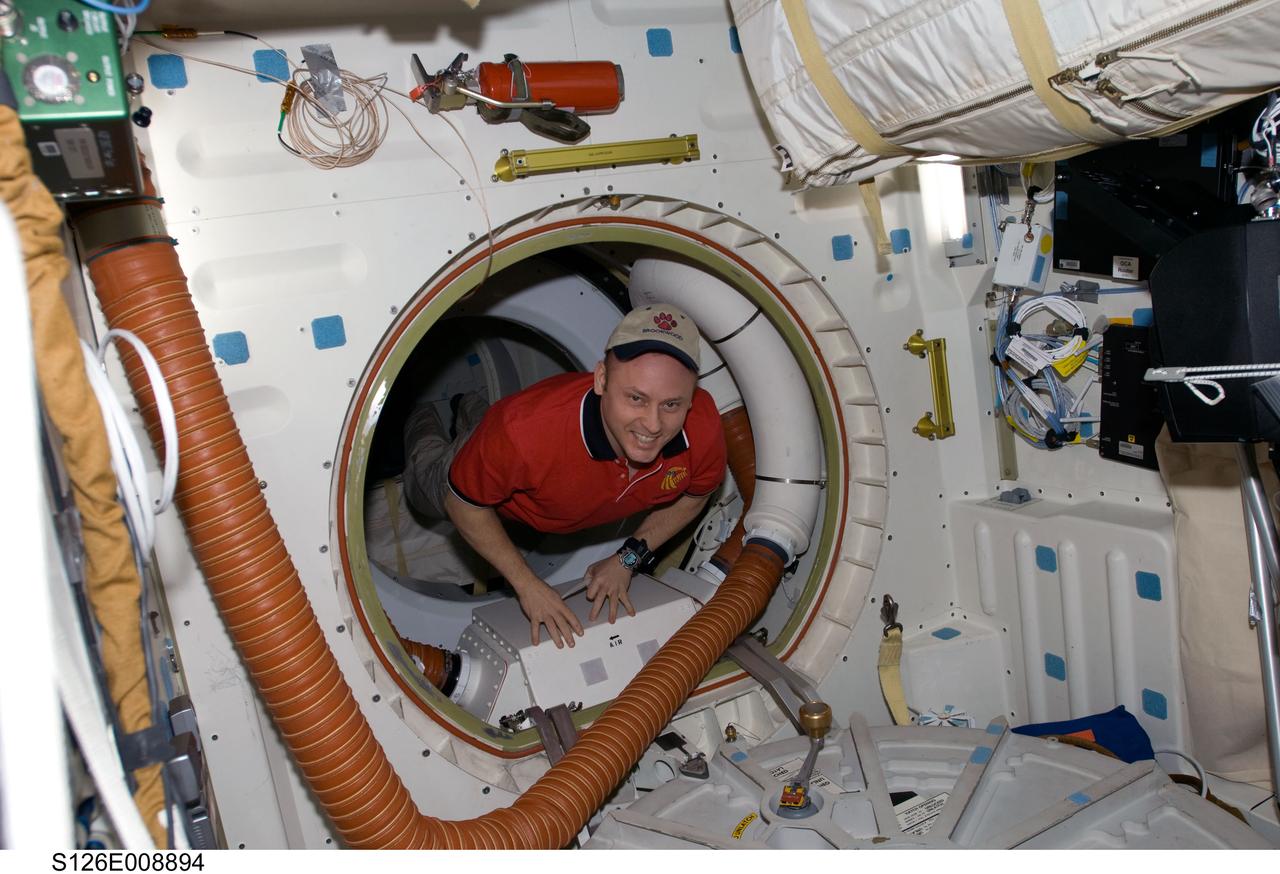 S126-E-008894 (21 Nov. 2008) --- This image, recorded in the late evening hours of Nov. 21, Houston time,  shows a smiling astronaut Michael Fincke, Expedition 18 commander, as he and his station crew near the mid point of joint efforts with the Endeavour crew,  commanded by astronaut Chris Ferguson (out of frame).  The two crews are spending close to two weeks in space together, accomplishing home improvement chores and a number of other tasks. Just a few hours after this photo was taken, two astronauts started prepping for the joint crews' third spacewalk of the week.