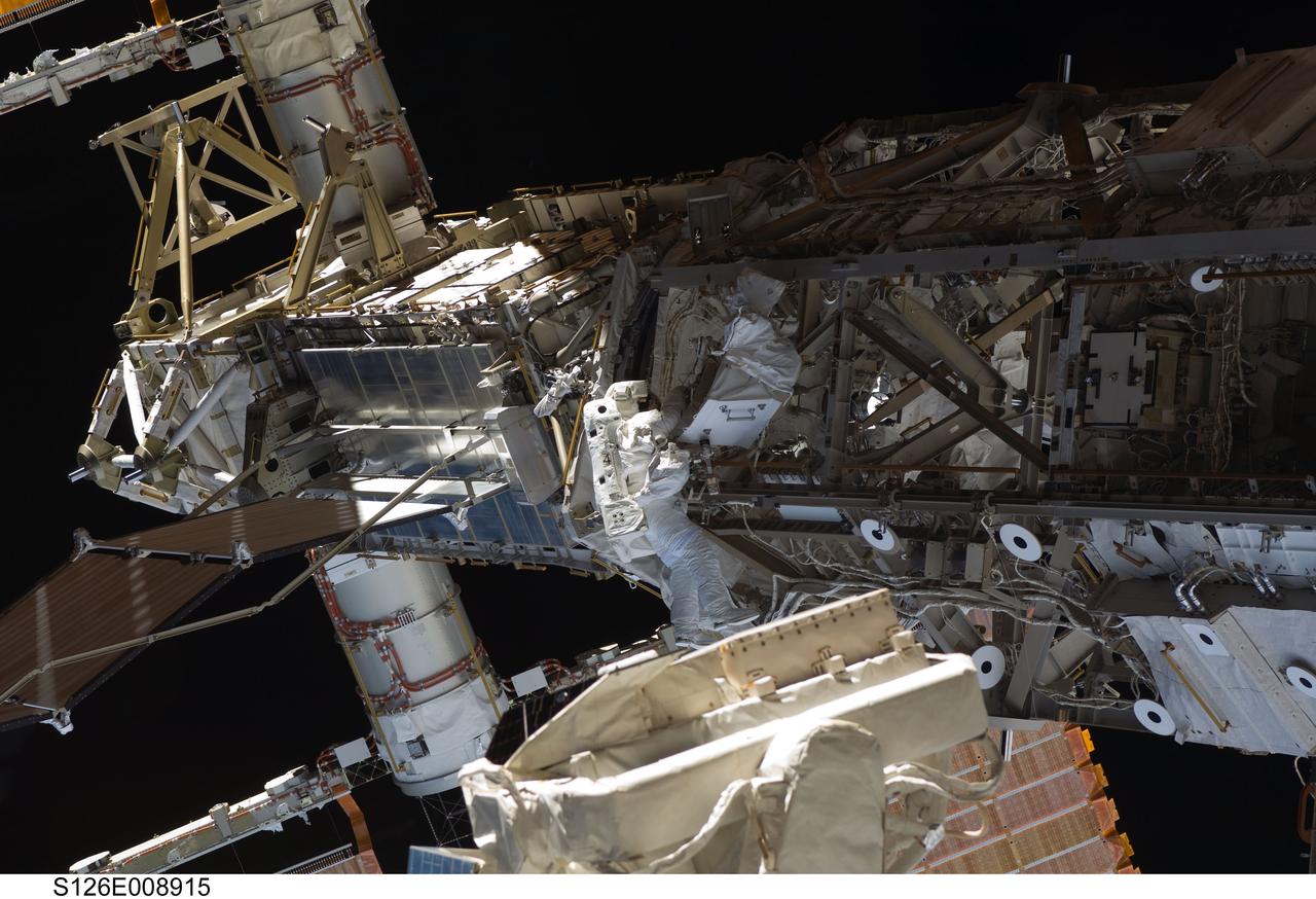 S126-E-008915 (22 Nov. 2008) --- Astronaut Steve Bowen, STS-126 mission specialist, participates in the mission's third scheduled session of extravehicular activity (EVA) as construction and maintenance continue on the International Space Station. During the six-hour, 57-minute spacewalk, Bowen and astronaut Heidemarie Stefanyshyn-Piper (out of frame), mission specialist, focused their efforts on the continued cleaning of the station's starboard solar alpha rotary joint (SARJ) and the removal and replacement of trundle bearing assemblies (TBA). Bowen and Piper also cleaned the area around the SARJ's drive lock assemblies, which help the joint to rotate and lock into place.