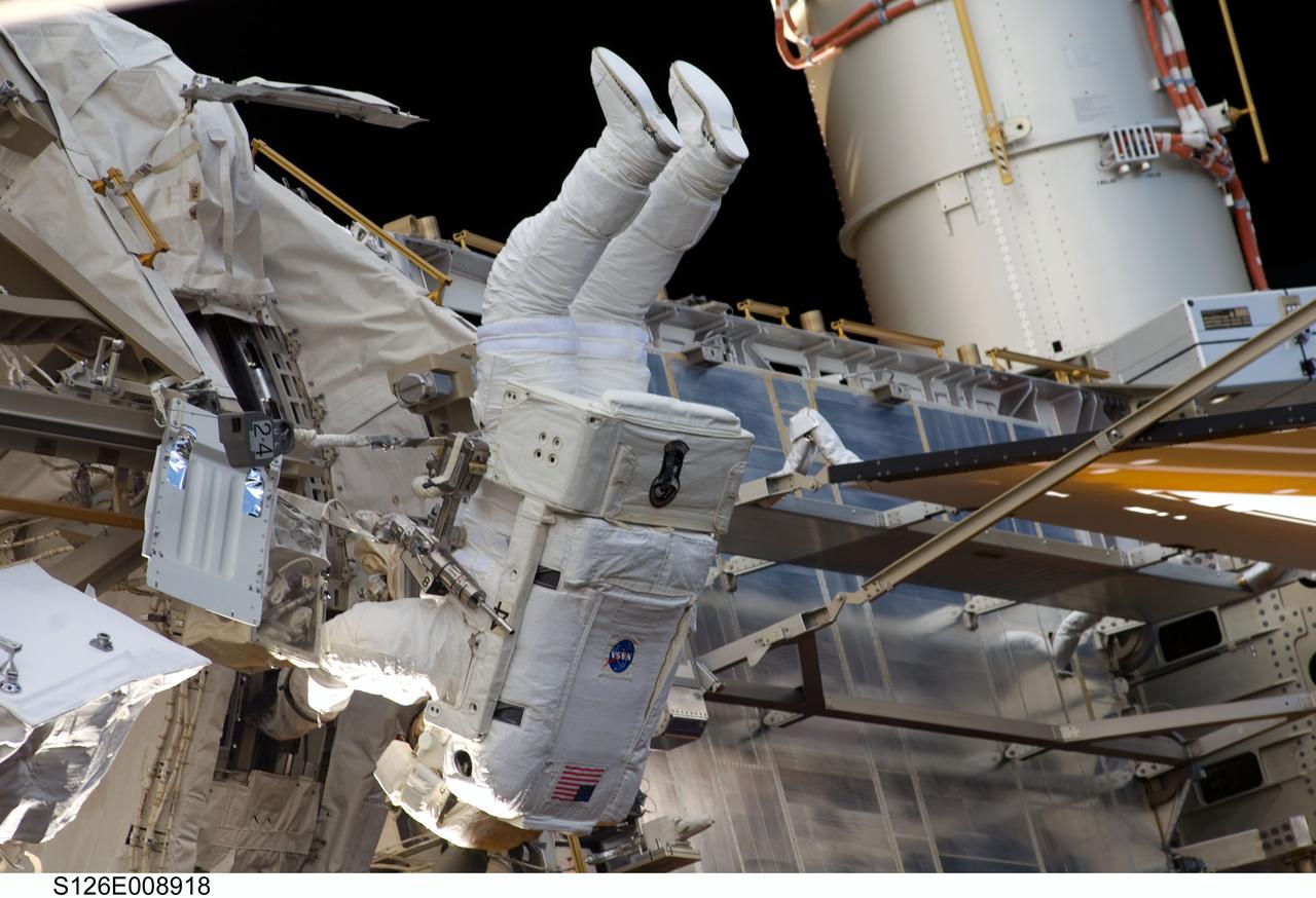 S126-E-008918 (22 Nov. 2008) --- Astronaut Steve Bowen, STS-126 mission specialist, participates in the mission's third scheduled session of extravehicular activity (EVA) as construction and maintenance continue on the International Space Station. During the six-hour, 57-minute spacewalk, Bowen and astronaut Heidemarie Stefanyshyn-Piper (out of frame), mission specialist, focused their efforts on the continued cleaning of the station's starboard solar alpha rotary joint (SARJ) and the removal and replacement of trundle bearing assemblies (TBA). Bowen and Piper also cleaned the area around the SARJ's drive lock assemblies, which help the joint to rotate and lock into place.