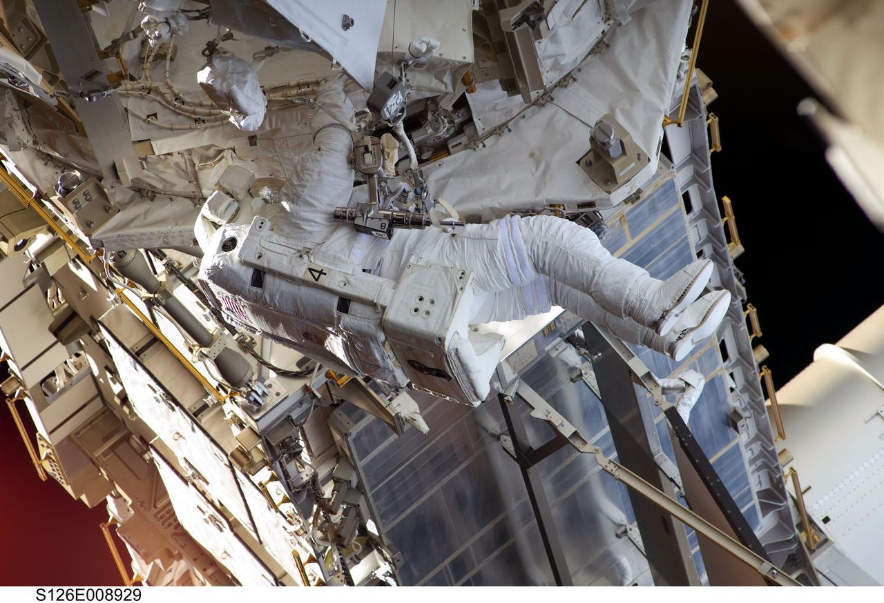 S126-E-008929 (22 Nov. 2008) --- Astronaut Steve Bowen, STS-126 mission specialist, participates in the mission's third scheduled session of extravehicular activity (EVA) as construction and maintenance continue on the International Space Station. During the six-hour, 57-minute spacewalk, Bowen and astronaut Heidemarie Stefanyshyn-Piper (out of frame), mission specialist, focused their efforts on the continued cleaning of the station's starboard solar alpha rotary joint (SARJ) and the removal and replacement of trundle bearing assemblies (TBA). Bowen and Piper also cleaned the area around the SARJ's drive lock assemblies, which help the joint to rotate and lock into place.