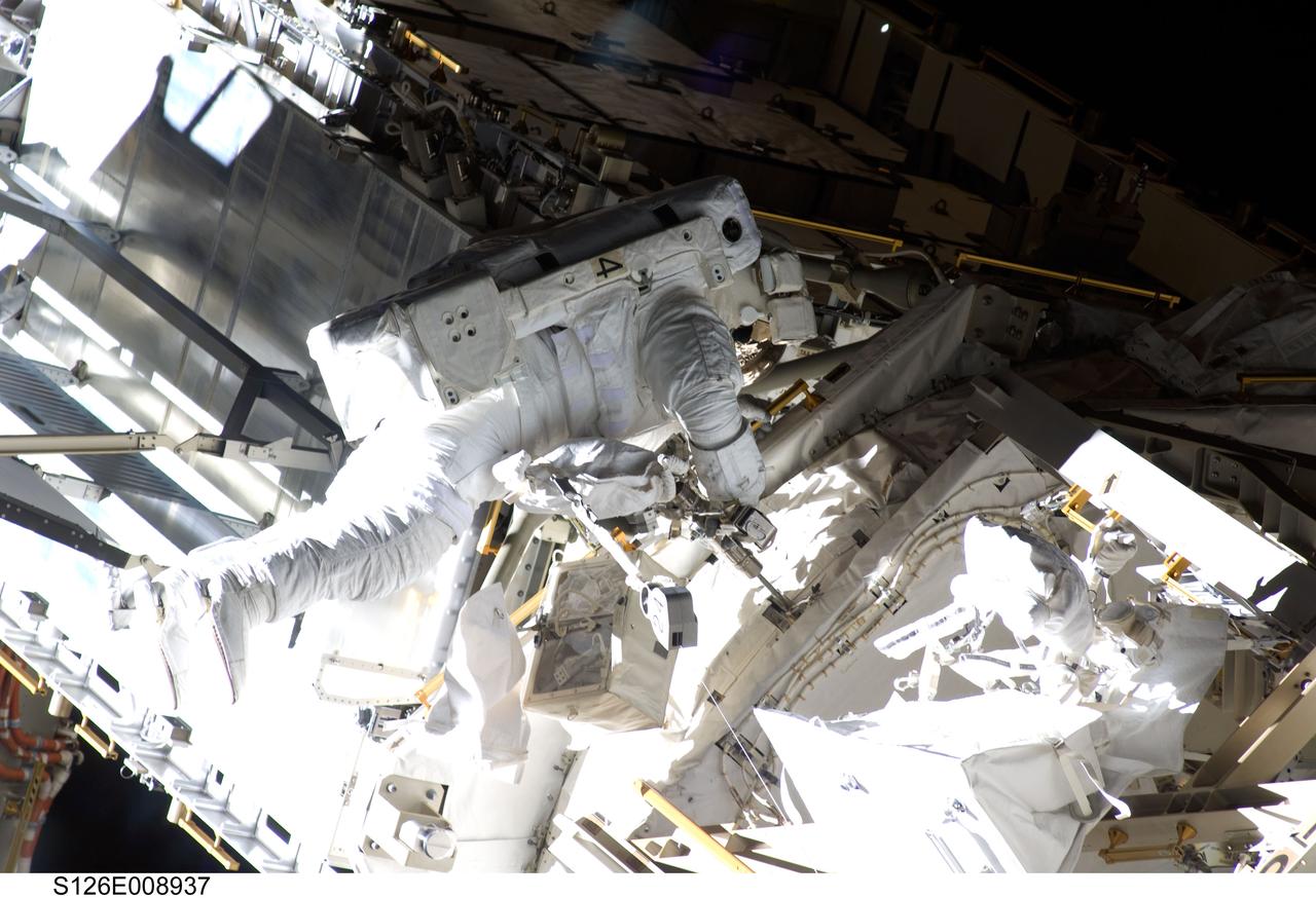 S126-E-008937 (22 Nov. 2008) --- Astronaut Steve Bowen, STS-126 mission specialist, participates in the mission's third scheduled session of extravehicular activity (EVA) as construction and maintenance continue on the International Space Station. During the six-hour, 57-minute spacewalk, Bowen and astronaut Heidemarie Stefanyshyn-Piper (out of frame), mission specialist, focused their efforts on the continued cleaning of the station's starboard solar alpha rotary joint (SARJ) and the removal and replacement of trundle bearing assemblies (TBA). Bowen and Piper also cleaned the area around the SARJ's drive lock assemblies, which help the joint to rotate and lock into place.