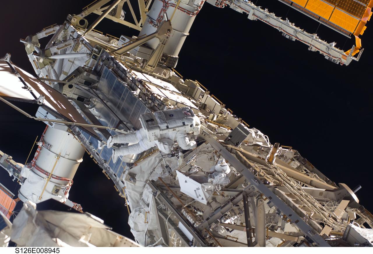 S126-E-008945 (22 Nov. 2008) --- Astronaut Steve Bowen, STS-126 mission specialist, participates in the mission's third scheduled session of extravehicular activity (EVA) as construction and maintenance continue on the International Space Station. During the six-hour, 57-minute spacewalk, Bowen and astronaut Heidemarie Stefanyshyn-Piper (out of frame), mission specialist, focused their efforts on the continued cleaning of the station's starboard solar alpha rotary joint (SARJ) and the removal and replacement of trundle bearing assemblies (TBA). Bowen and Piper also cleaned the area around the SARJ's drive lock assemblies, which help the joint to rotate and lock into place.