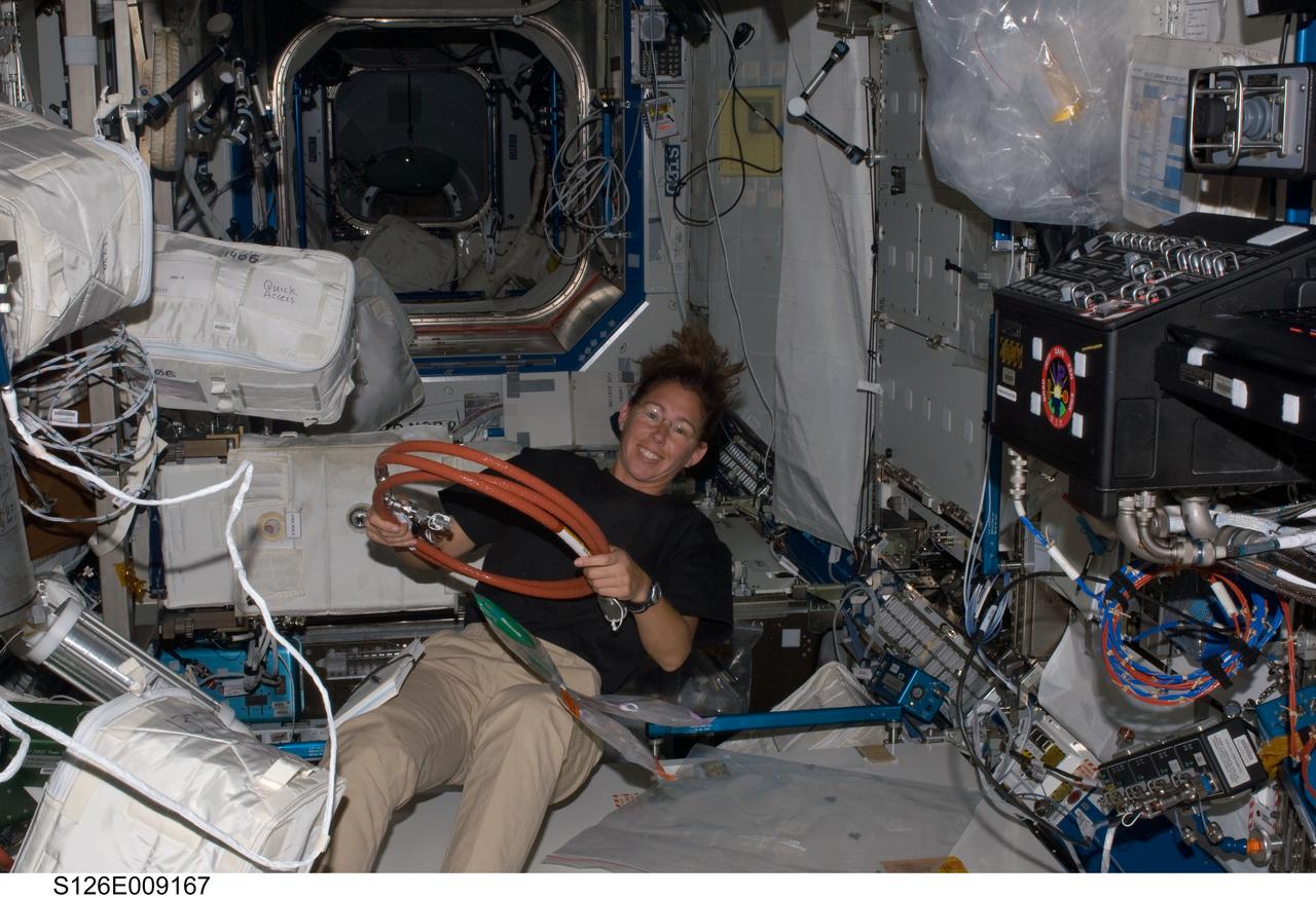 S126-E-009167 (22 Nov. 2008) --- Astronaut Sandra Magnus, Expedition 18 flight engineer, works in the Destiny laboratory of the International Space Station while Space Shuttle Endeavour (STS-126) remains docked with the station.