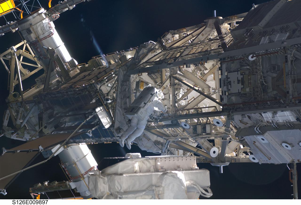 S126-E-009897 (24 Nov. 2008) --- Astronaut Steve Bowen, STS-126 mission specialist, participates in the mission's fourth and final scheduled session of extravehicular activity (EVA) as construction and maintenance continue on the International Space Station. During the six-hour, seven-minute spacewalk, Bowen and astronaut Shane Kimbrough (out of frame), mission specialist, completed the lubrication of the port Solar Alpha Rotary Joints (SARJ) as well as other station assembly tasks. Bowen returned to the starboard SARJ to install the final trundle bearing assembly, retracted a berthing mechanism latch on the Japanese Kibo Laboratory and reinstalled its thermal cover. Bowen also installed a video camera on the Port 1 truss and attached a Global Positioning System antenna on the Japanese Experiment Module Pressurized Section.