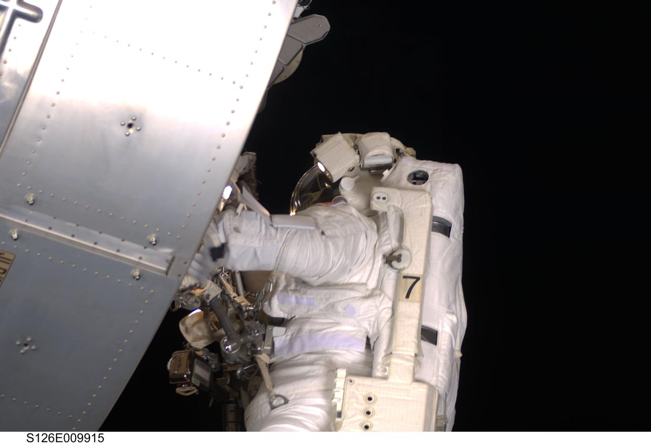 S126-E-009915 (24 Nov. 2008) --- Astronaut Steve Bowen, STS-126 mission specialist, participates in the mission's fourth and final scheduled session of extravehicular activity (EVA) as construction and maintenance continue on the International Space Station. During the six-hour, seven-minute spacewalk, Bowen and astronaut Shane Kimbrough (out of frame), mission specialist, completed the lubrication of the port Solar Alpha Rotary Joints (SARJ) as well as other station assembly tasks. Bowen returned to the starboard SARJ to install the final trundle bearing assembly, retracted a berthing mechanism latch on the Japanese Kibo Laboratory and reinstalled its thermal cover. Bowen also installed a video camera on the Port 1 truss and attached a Global Positioning System antenna on the Japanese Experiment Module Pressurized Section.