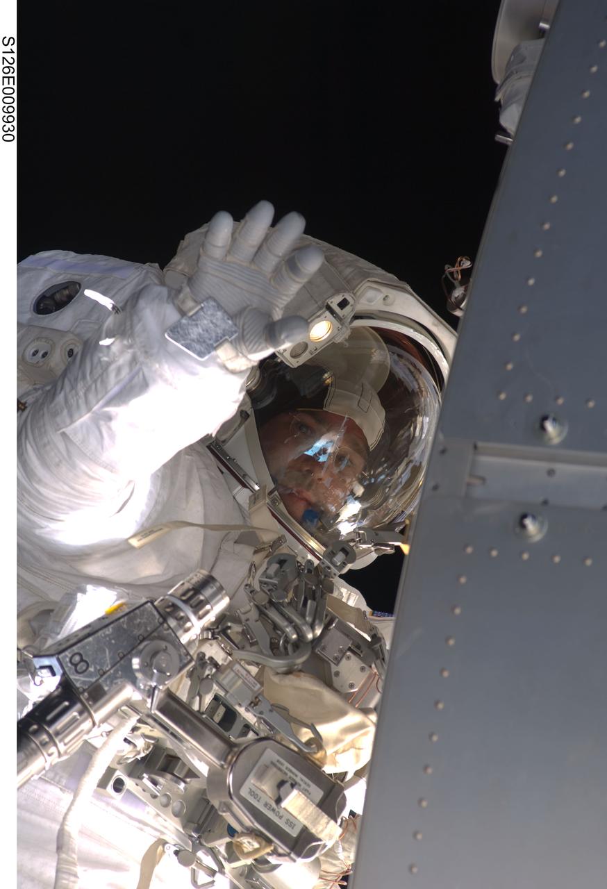 S126-E-009930 (24 Nov. 2008) --- Astronaut Steve Bowen, STS-126 mission specialist, participates in the mission's fourth and final scheduled session of extravehicular activity (EVA) as construction and maintenance continue on the International Space Station. During the six-hour, seven-minute spacewalk, Bowen and astronaut Shane Kimbrough (out of frame), mission specialist, completed the lubrication of the port Solar Alpha Rotary Joints (SARJ) as well as other station assembly tasks. Bowen returned to the starboard SARJ to install the final trundle bearing assembly, retracted a berthing mechanism latch on the Japanese Kibo Laboratory and reinstalled its thermal cover. Bowen also installed a video camera on the Port 1 truss and attached a Global Positioning System antenna on the Japanese Experiment Module Pressurized Section.