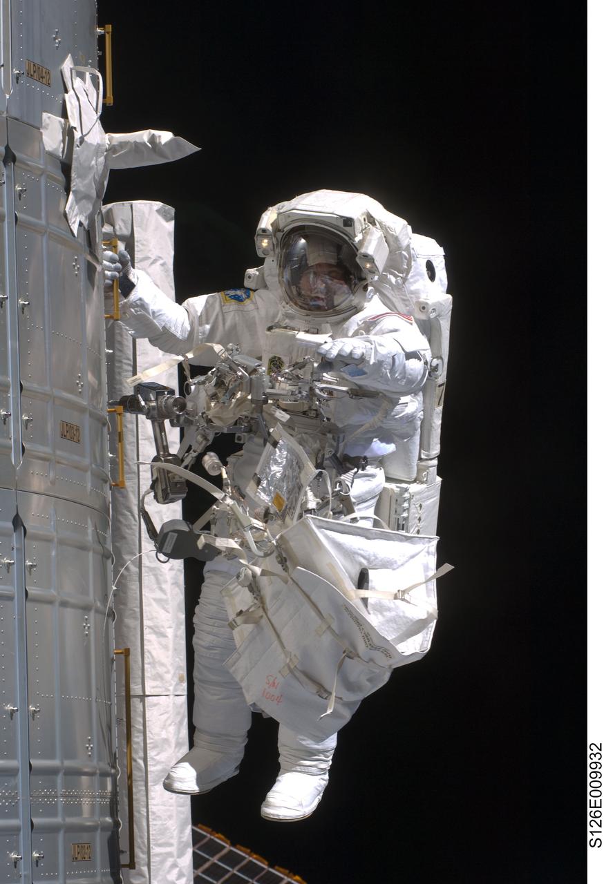 S126-E-009932 (24 Nov. 2008) --- Astronaut Steve Bowen, STS-126 mission specialist, participates in the mission's fourth and final scheduled session of extravehicular activity (EVA) as construction and maintenance continue on the International Space Station. During the six-hour, seven-minute spacewalk, Bowen and astronaut Shane Kimbrough (out of frame), mission specialist, completed the lubrication of the port Solar Alpha Rotary Joints (SARJ) as well as other station assembly tasks. Bowen returned to the starboard SARJ to install the final trundle bearing assembly, retracted a berthing mechanism latch on the Japanese Kibo Laboratory and reinstalled its thermal cover. Bowen also installed a video camera on the Port 1 truss and attached a Global Positioning System antenna on the Japanese Experiment Module Pressurized Section.