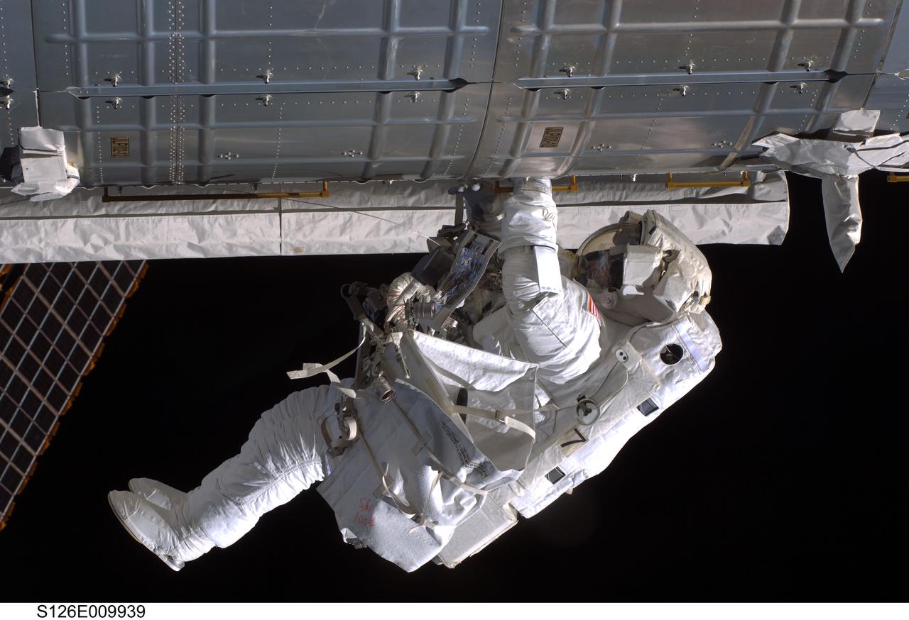 S126-E-009939 (24 Nov. 2008) --- Astronaut Steve Bowen, STS-126 mission specialist, participates in the mission's fourth and final scheduled session of extravehicular activity (EVA) as construction and maintenance continue on the International Space Station. During the six-hour, seven-minute spacewalk, Bowen and astronaut Shane Kimbrough (out of frame), mission specialist, completed the lubrication of the port Solar Alpha Rotary Joints (SARJ) as well as other station assembly tasks. Bowen returned to the starboard SARJ to install the final trundle bearing assembly, retracted a berthing mechanism latch on the Japanese Kibo Laboratory and reinstalled its thermal cover. Bowen also installed a video camera on the Port 1 truss and attached a Global Positioning System antenna on the Japanese Experiment Module Pressurized Section.