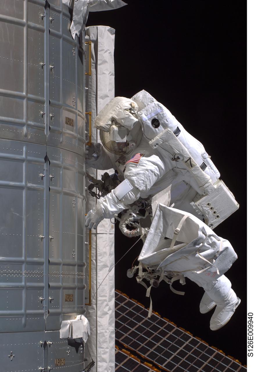 S126-E-009940 (24 Nov. 2008) --- Astronaut Steve Bowen, STS-126 mission specialist, participates in the mission's fourth and final scheduled session of extravehicular activity (EVA) as construction and maintenance continue on the International Space Station. During the six-hour, seven-minute spacewalk, Bowen and astronaut Shane Kimbrough (out of frame), mission specialist, completed the lubrication of the port Solar Alpha Rotary Joints (SARJ) as well as other station assembly tasks. Bowen returned to the starboard SARJ to install the final trundle bearing assembly, retracted a berthing mechanism latch on the Japanese Kibo Laboratory and reinstalled its thermal cover. Bowen also installed a video camera on the Port 1 truss and attached a Global Positioning System antenna on the Japanese Experiment Module Pressurized Section.