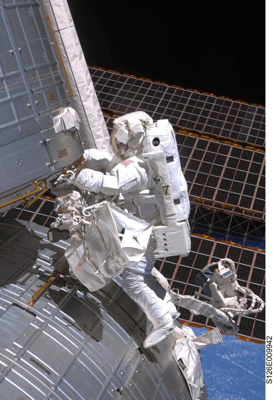 S126-E-009942 (24 Nov. 2008) --- Astronaut Steve Bowen, STS-126 mission specialist, participates in the mission's fourth and final scheduled session of extravehicular activity (EVA) as construction and maintenance continue on the International Space Station. During the six-hour, seven-minute spacewalk, Bowen and astronaut Shane Kimbrough (out of frame), mission specialist, completed the lubrication of the port Solar Alpha Rotary Joints (SARJ) as well as other station assembly tasks. Bowen returned to the starboard SARJ to install the final trundle bearing assembly, retracted a berthing mechanism latch on the Japanese Kibo Laboratory and reinstalled its thermal cover. Bowen also installed a video camera on the Port 1 truss and attached a Global Positioning System antenna on the Japanese Experiment Module Pressurized Section.