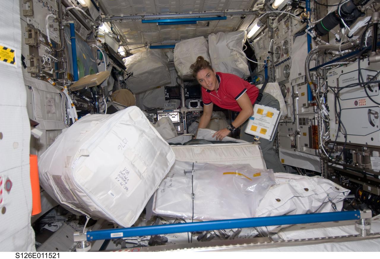 S126-E-011521 (26 Nov. 2008) --- Astronaut Heidemarie Stefanyshyn-Piper, STS-126 mission specialist, works with transfer of supplies in the Columbus lab of the International Space Station.