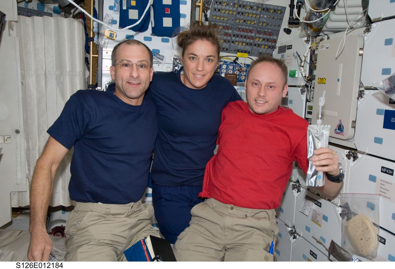 S126-E-012184 (27 Nov. 2008) --- The astronaut class of 1996 was able to have its own mini-reunion with three members of that group sharing home improvement and other duties aboard the International Space Station over the last two weeks. From left, astronauts Donald Pettit, Heidemarie Stefanyshyn-Piper and Michael Fincke pose for a photo on the middeck of Endeavour on the eve of the day the crews of the space shuttle and the orbital outpost's Expedition 18 went separate ways. Fincke, Expedition 18 commander, later stayed behind on the orbital outpost as Stefanyshyn-Piper and Pettit and the rest of the shuttle crew bade farewell with plans of being home on Nov. 30.