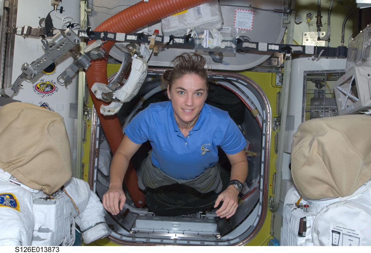 S126-E-013873 (27 Nov. 2008) --- Astronaut Heidemarie Stefanyshyn-Piper, mission specialist, floats into the equipment area of the Quest Airlock of the International Space Station on Thanksgiving Day. One more day remains for the Space Shuttle Endeavour to be docked with the station.
