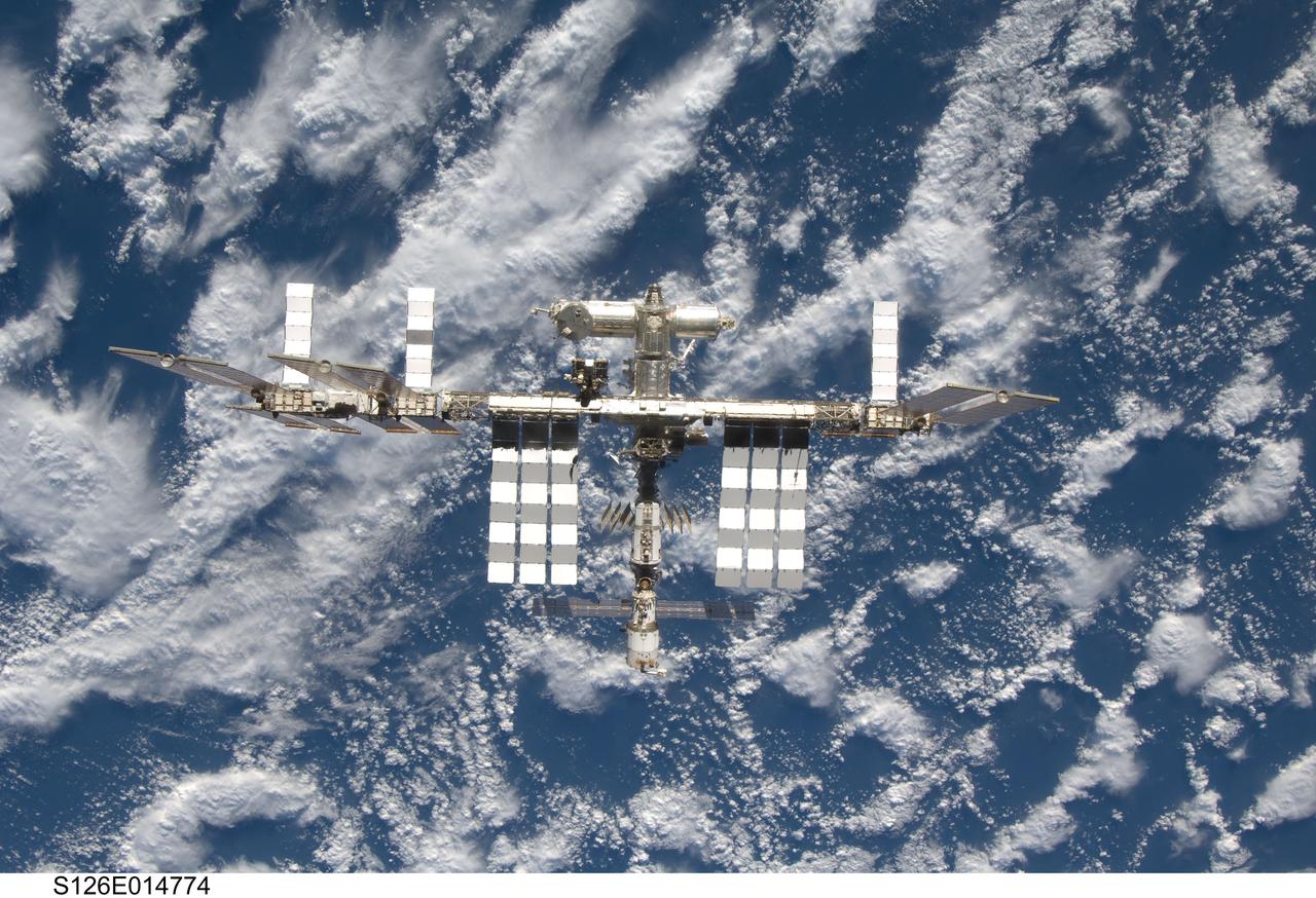 S126-E-014774 (28 Nov. 2008) --- Backdropped by a blue and white Earth, the International Space Station is seen from Space Shuttle Endeavour as the two spacecraft begin their relative separation. Earlier the STS-126 and Expedition 18 crews concluded 11 days, 16 hours and 46 minutes of cooperative work onboard the shuttle and station. Undocking of the two spacecraft occurred at 8:47 a.m. (CST) on Nov. 28, 2008.