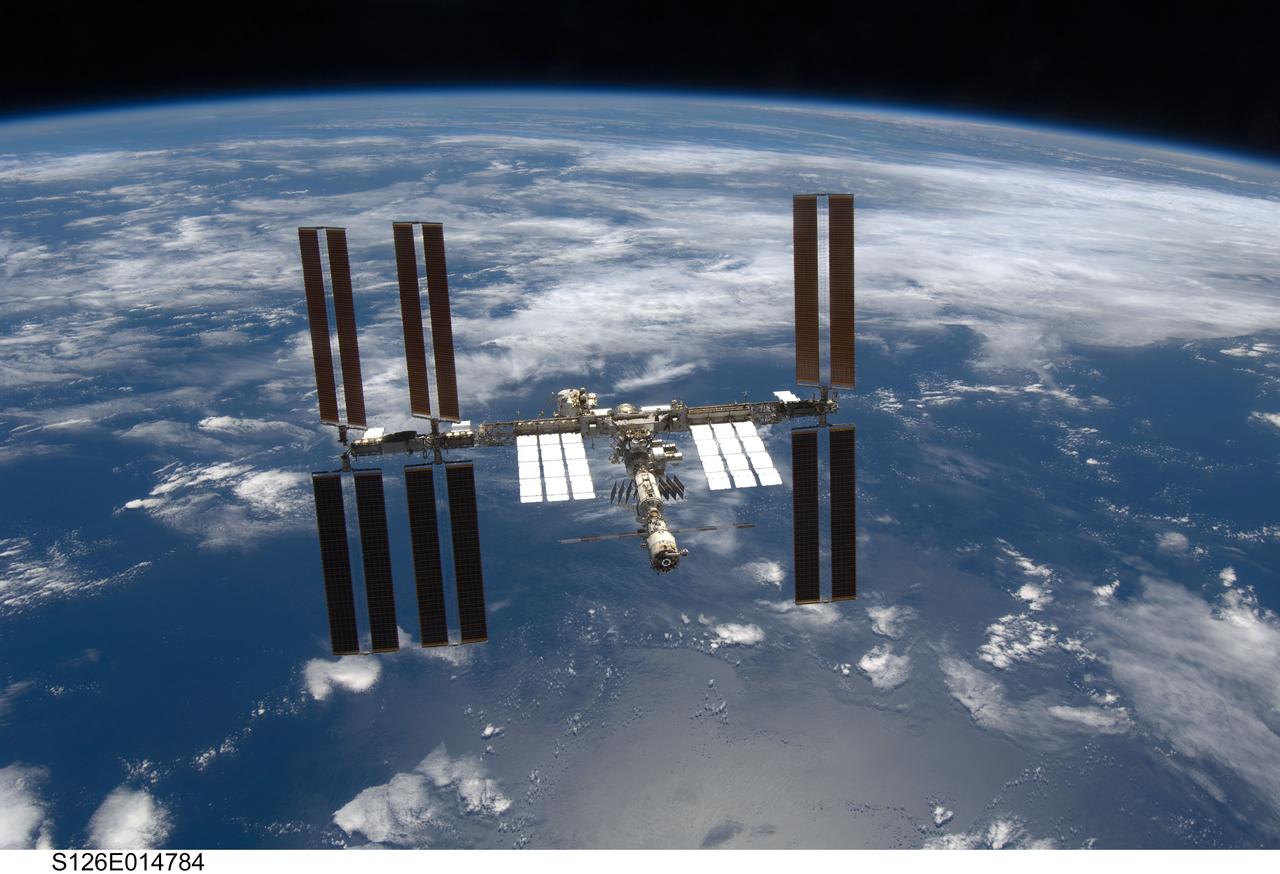 S126-E-014784 (28 Nov. 2008) --- Backdropped by a blue and white Earth and the blackness of space, the International Space Station is seen from Space Shuttle Endeavour as the two spacecraft begin their relative separation. Earlier the STS-126 and Expedition 18 crews concluded 11 days, 16 hours and 46 minutes of cooperative work onboard the shuttle and station. Undocking of the two spacecraft occurred at 8:47 a.m. (CST) on Nov. 28, 2008.