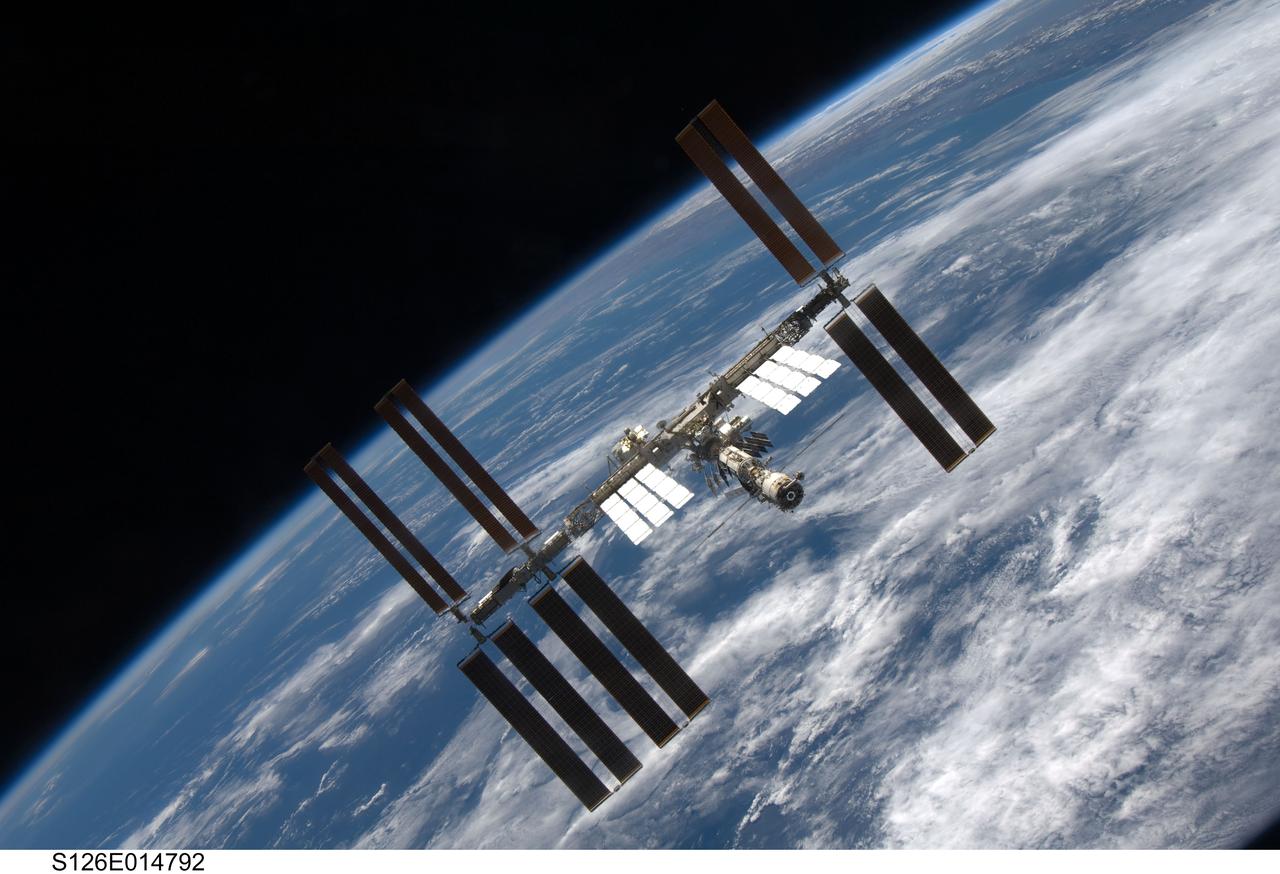 S126-E-014792 (28 Nov. 2008) --- Backdropped by a blue and white Earth and the blackness of space, the International Space Station is seen from Space Shuttle Endeavour as the two spacecraft begin their relative separation. Earlier the STS-126 and Expedition 18 crews concluded 11 days, 16 hours and 46 minutes of cooperative work onboard the shuttle and station. Undocking of the two spacecraft occurred at 8:47 a.m. (CST) on Nov. 28, 2008.