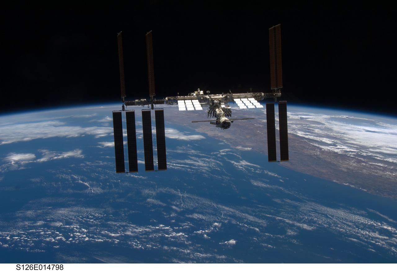 S126-E-014798 (28 Nov. 2008) --- Backdropped by a colorful Earth and the blackness of space, the International Space Station is seen from Space Shuttle Endeavour as the two spacecraft begin their relative separation. Earlier the STS-126 and Expedition 18 crews concluded 11 days, 16 hours and 46 minutes of cooperative work onboard the shuttle and station. Undocking of the two spacecraft occurred at 8:47 a.m. (CST) on Nov. 28, 2008.