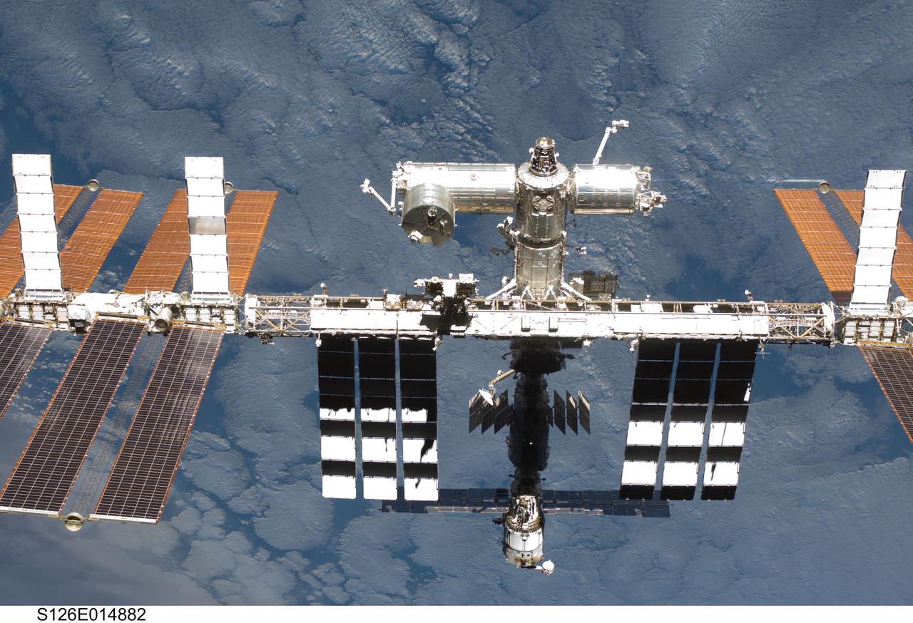 S126-E-014882 (28 Nov. 2008) --- Backdropped by a cloud-covered part of Earth, the International Space Station is seen from Space Shuttle Endeavour as the two spacecraft begin their relative separation. Earlier the STS-126 and Expedition 18 crews concluded 11 days, 16 hours and 46 minutes of cooperative work onboard the shuttle and station. Undocking of the two spacecraft occurred at 8:47 a.m. (CST) on Nov. 28, 2008.