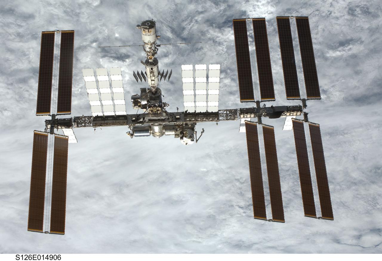 S126-E-014906 (28 Nov. 2008) --- Backdropped by a cloud-covered part of Earth, the International Space Station is seen from Space Shuttle Endeavour as the two spacecraft begin their relative separation. Earlier the STS-126 and Expedition 18 crews concluded 11 days, 16 hours and 46 minutes of cooperative work onboard the shuttle and station. Undocking of the two spacecraft occurred at 8:47 a.m. (CST) on Nov. 28, 2008.