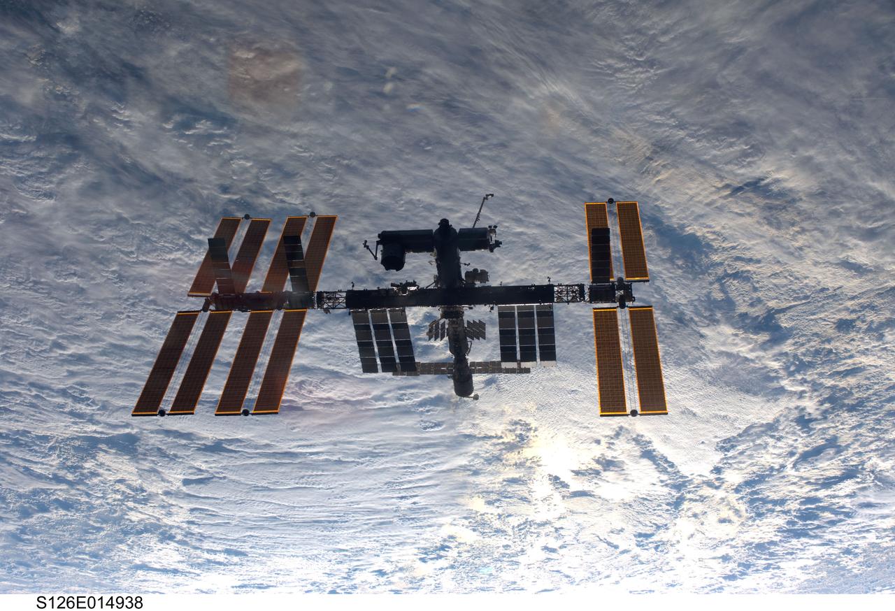 S126-E-014938 (28 Nov. 2008) --- Backdropped by a cloud-covered part of Earth, the International Space Station is seen from Space Shuttle Endeavour as the two spacecraft begin their relative separation. Earlier the STS-126 and Expedition 18 crews concluded 11 days, 16 hours and 46 minutes of cooperative work onboard the shuttle and station. Undocking of the two spacecraft occurred at 8:47 a.m. (CST) on Nov. 28, 2008.
